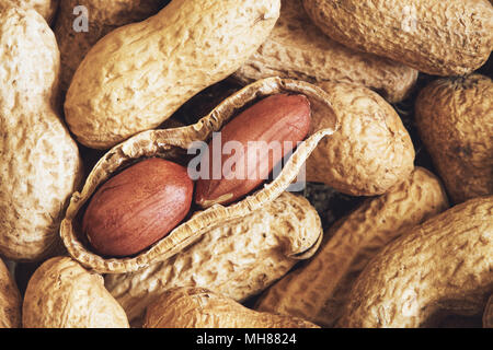 Pile of dry roasted peanuts (salted, in shell) Stock Photo