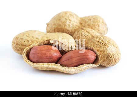Roasted peanuts (salted, in shell) isolated on white background Stock Photo
