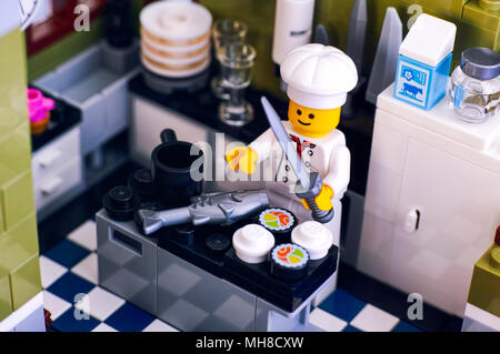 Tambov, Russian Federation - January 04, 2018 Lego chef cooking sushi and fish in the kitchen. Stock Photo