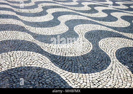 Lisbon wave mosaic cobblestone pavement close up Stock Photo