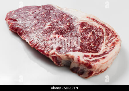 Ripened seasoned beef rump or striploin steak on white background isolated Stock Photo