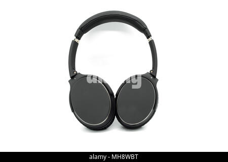A set or pair of headphones with black cushioned earpads and siver embelishments. Image is isolated on a white background. Stock Photo