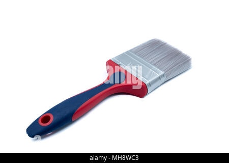 A disposable plastic paintbrush with a red and blue plastic handle isolated on a white background Stock Photo