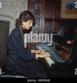 Washington, DC, USA 13th, October 1982 Jehan Sadat one of Anwar Sadat's daughters named after her mother, playing the piano at the national press club. Stock Photo