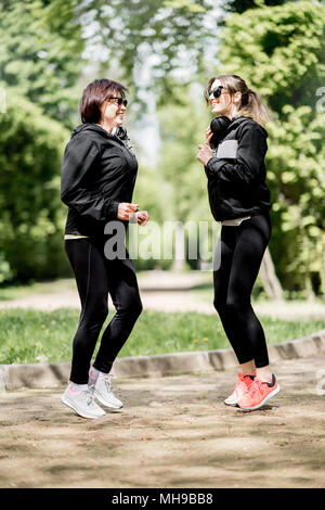 Two woman exercising in the park Stock Photo