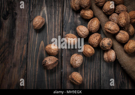 Almonds, walnuts and hazelnuts on wooden table. assortment of nuts Stock Photo