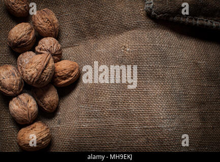 Almonds, walnuts and hazelnuts on wooden table. assortment of nuts Stock Photo