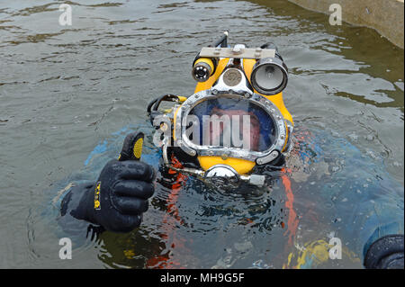 commercial diver in mask giving the thumbs up Stock Photo