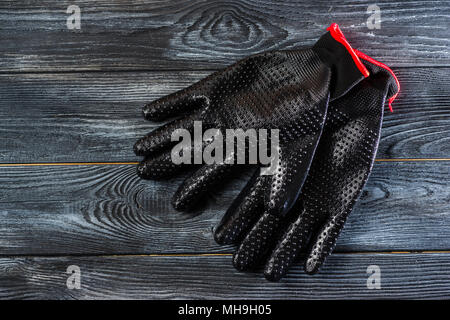 black rubberized gloves for work Stock Photo