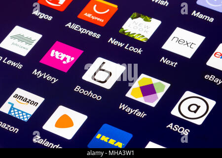 Icons on a tablet for online shops in the UK. Shopping online on a mobile device. Modern Internet shopping shortcuts. Stock Photo