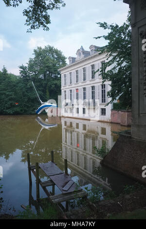 Café and boat in the Middelheim open air museum in Antwerp, Belgium. Stock Photo