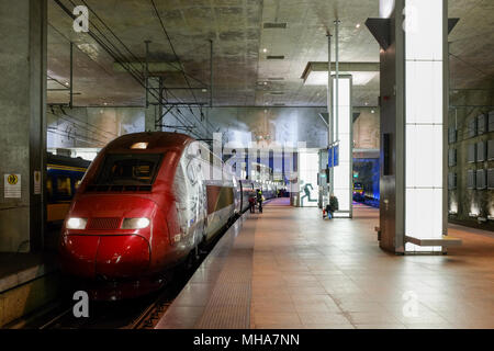 People boarding the Paris bound Thalys train from Antwerp central train station. Stock Photo