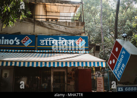 an Indian domino's pizza on a street corner in Mumbai, India Stock Photo