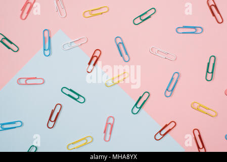 colourful paper clips on colourful pastel colour background. diversity and stationery background concept Stock Photo