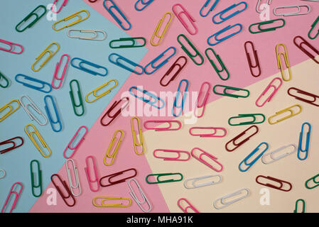 colourful paper clips on colourful pastel colour background. diversity and stationery background concept Stock Photo