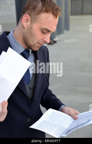 businessman emotionally reading documents Stock Photo