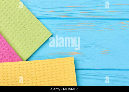 Kitchen napkins on blue wooden background. Stock Photo