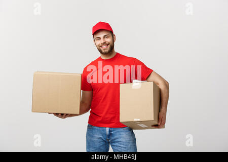 Happy smiling delivery boy with white sign board looking at camera ...