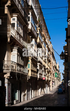 Valletta's streets are packed into a constrained space bound by thick walls leading to long and narrow streets. Valletta, Malta Stock Photo