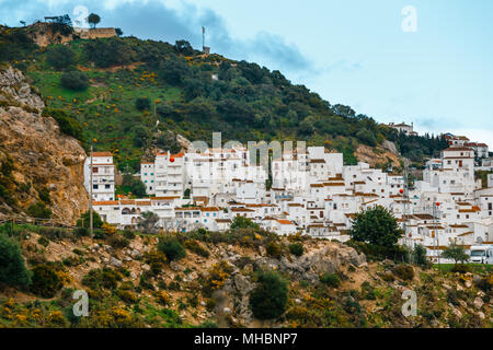 White Andalusian village - pueblo blanco - in the mountain range in Casares during sunset Stock Photo