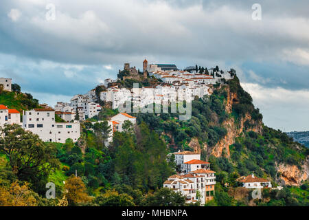 White Andalusian village - pueblo blanco - in the mountain range in Casares during sunset Stock Photo