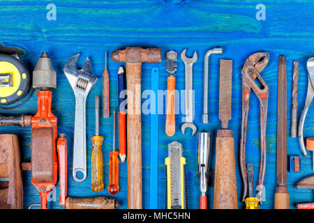 Many manual tools on wood painted blue color background. Stock Photo