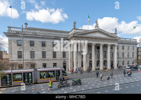 Luas tram passes in front of the GPO on a busy O'Connell Street, Dublin, Ireland Stock Photo