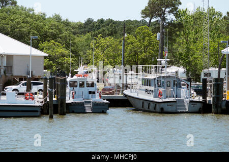 Pilot Boats sit dockside in the harbor at Dauphin Island. Stock Photo