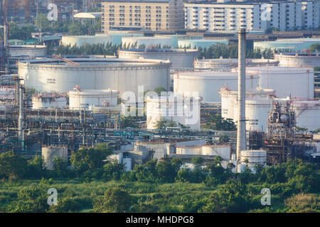 Oil refinery industry And Petrochemical plant in city ,near forest Stock Photo