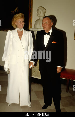 Washington DC. USA, 18th June, 1984 Frank and Barbara Sinatra pose as they arrive for the State dinner at the White House. Frank was the entertainment that evening. Credit:Mark Reinstein /MediaPunch Stock Photo
