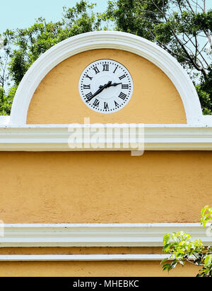 Old clock on the facade of a sugar mill hacienda in Mexico Stock Photo
