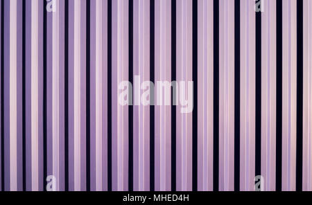 Shade and shadow from rim light effect during the sunset time the impact on the surface of the deep blue metal sheet wall. Stock Photo