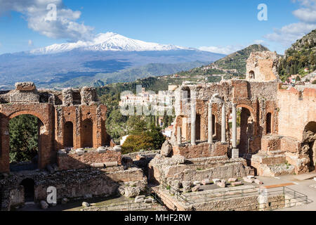 Ancient Greek-Roman theatre of Taormina with town and Mount Etna, Sicily. Stock Photo