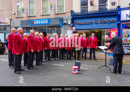 Hereford Rail Male Voice Choir, raising money for the Midlands Air Ambulance Charity. Broad Street Hereford UK. April 2018 Stock Photo