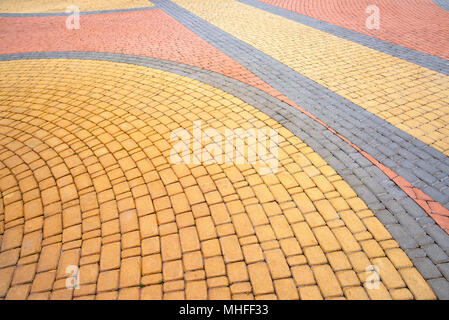 Detail of a nice artistic colorful cobblestones pavement in the Natalka park of Kiev, Ukraine Stock Photo