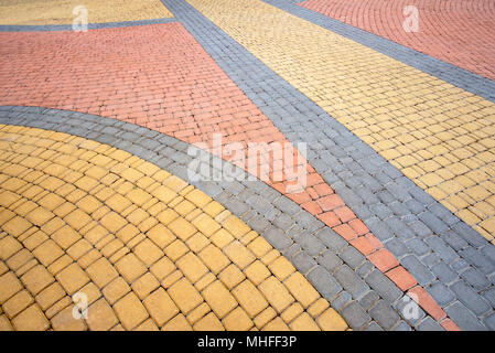 Detail of a nice artistic colorful cobblestones pavement in the Natalka park of Kiev, Ukraine Stock Photo