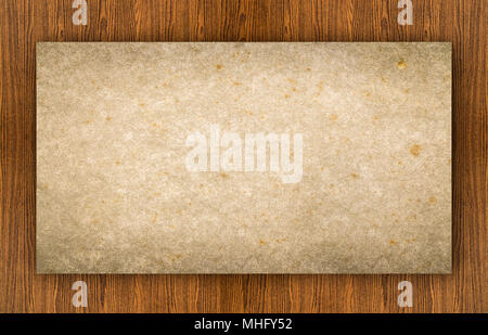 Old grunge blank paper put on wooden tabletop use for texts or products display Stock Photo