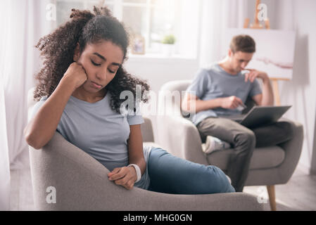 Sad young woman feeling lonely Stock Photo