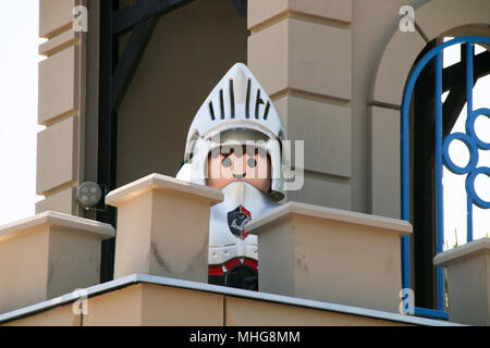 Zirndorf, Germany - April 29, 2018: View of an oversized Playmobil knight guarding a castle in the Playmobil Funpark in Zirndorf near Nuremberg. Stock Photo