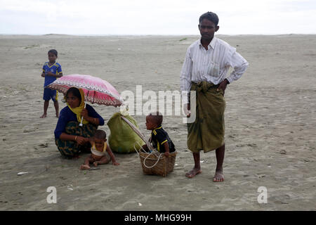 Rohingya refugees arrived at Shah Porir Dweep from Myanmar crossing the Naf River by boat. Teknaf, Cox's Bazar, Bangladesh. Stock Photo