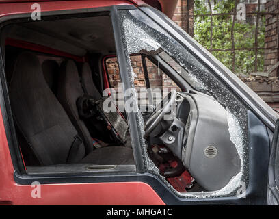 Damaged window pane of a van cracked by theft. Stock Photo