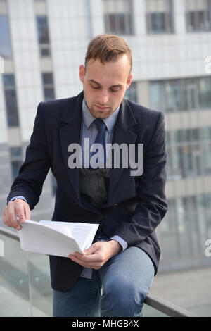 businessman emotionally reading documents Stock Photo