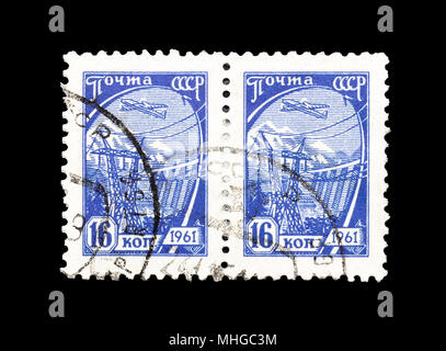 Cancelled postage stamps printed by Soviet Union,that shows Hydroelectric Dam and High Voltage Line, circa 1961. Stock Photo