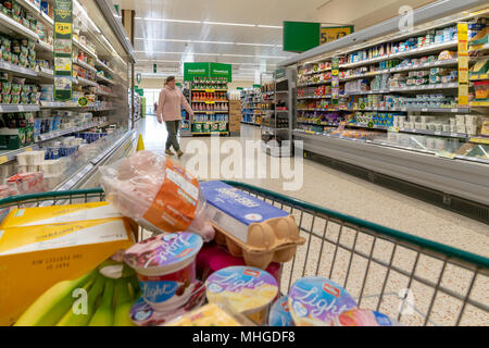 A trolley full of groceries in Morrisons supermarket in Stockton Heath, near Warrington, Cheshire, England, UK on 30 April 2018 Stock Photo