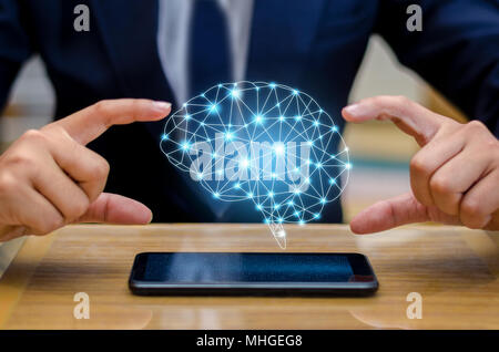 Hand Businesspeople press the phone. Brain Graphic Binary Blue Technology Stock Photo