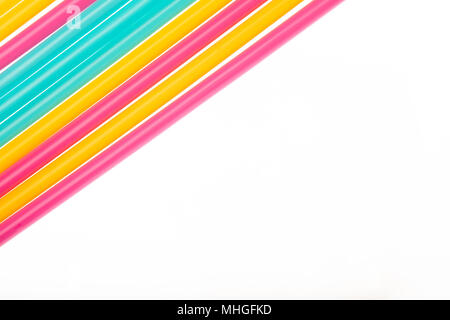 Top view of drinking straws colorful plastic tubes over white as abstract background with copy space Stock Photo