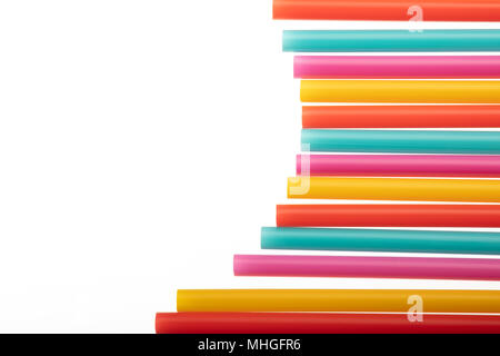 Drinking straw colorful plastic tubes over white as abstract background with copy space Stock Photo