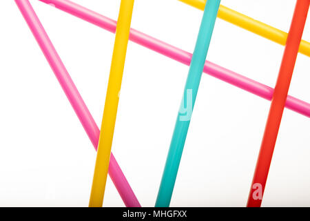Drinking straws for party on white background. Top view of colorful straws for cocktails. Place for text, copy space. Stock Photo