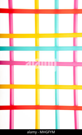 View of a colored pattern with lines of different colors straws on white background Stock Photo