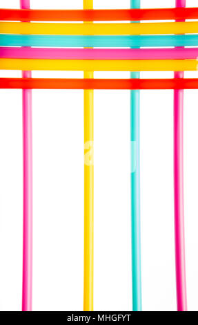Background with multicolored straws parallel and crossed lines on white background Stock Photo